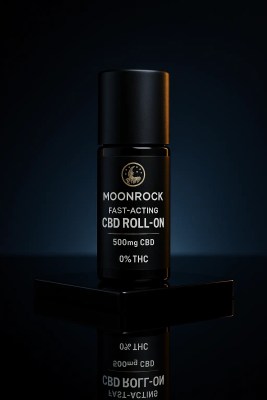 Fast-acting CBD roll-on standing on a glossy black surface with a refined mirror reflection and deep indigo gradient.