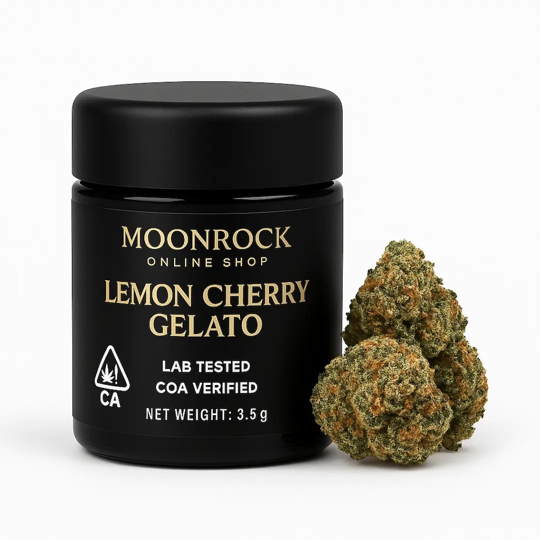 Premium Lemon Cherry Gelato strain in matte black Moonrock jar labeled 3.5g, COA verified and lab tested with CA cannabis symbol, shown beside dense frosty buds on white background.