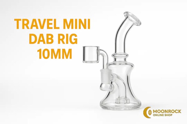 Travel Mini Dab Rig 10mm in emerald glass with micro flat-top quartz banger on a clean studio background