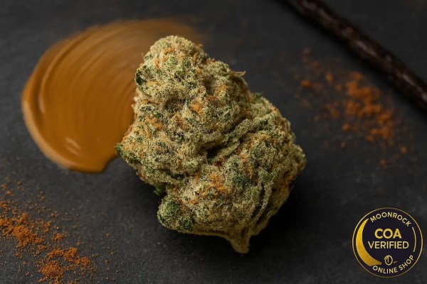 Buy Peanut Butter Breath strain online hero image showing frosty buds with peanut, cocoa, and vanilla accents
