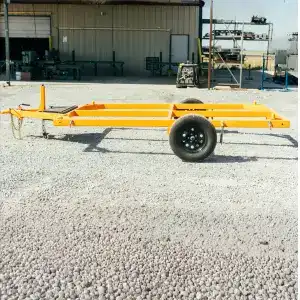 jeep transport trailer gravel parking lot in front of an industrial building