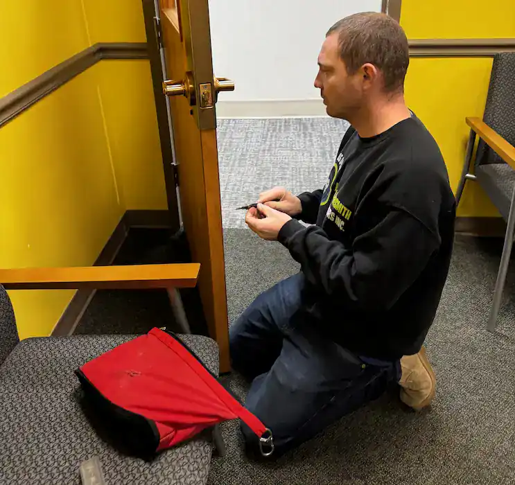 King Locksmith and Doors technician rekeys a residential door lock inside a Hyattsville, Maryland home to restore secure and reliable access.