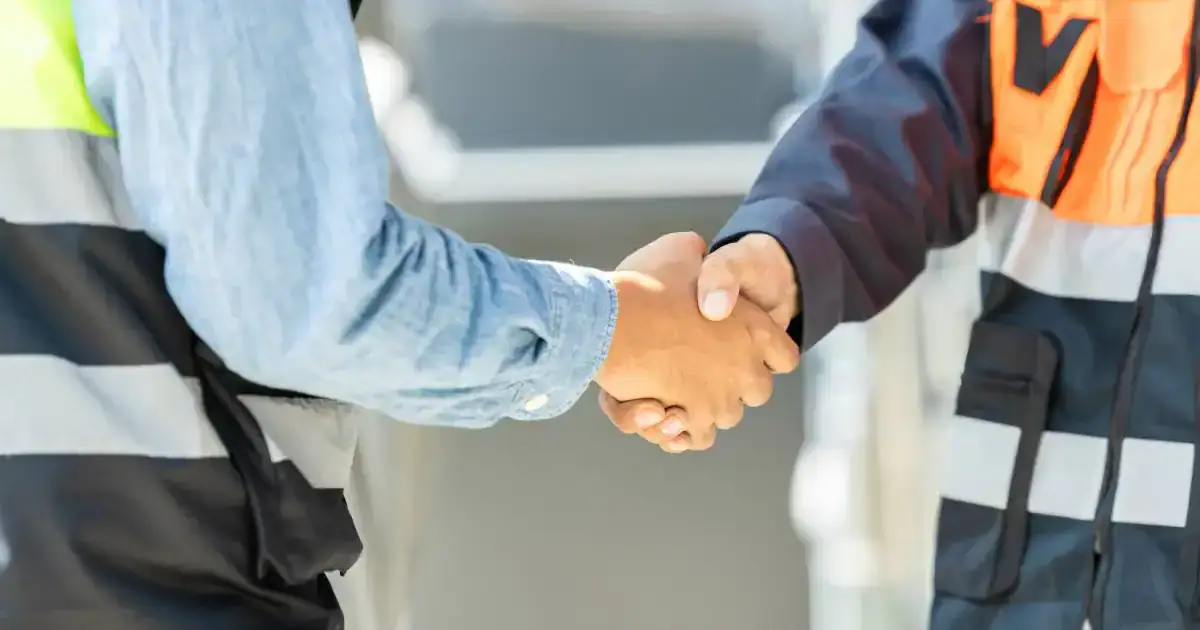 Professional handshake representing trusted, ongoing locksmith maintenance and long-term security support