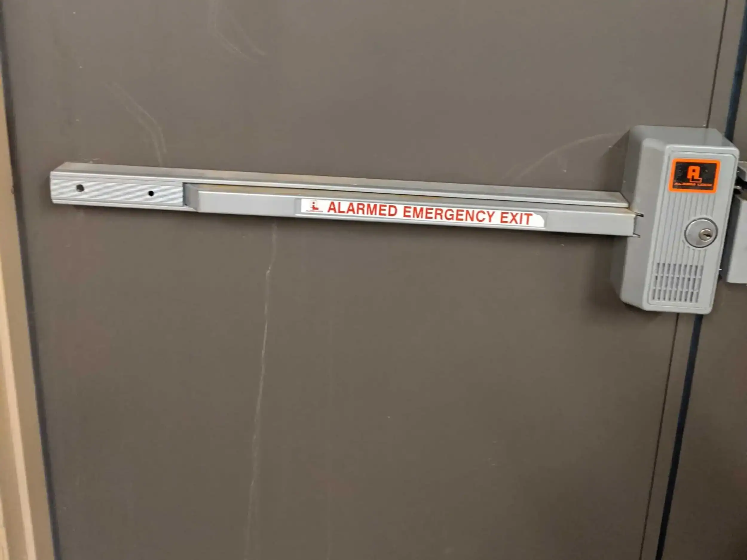 Alarmed Emergency Exit Device Installed On A Commercial Door And Maintained By A Locksmith Rockville Md To Support Life Safety Compliance And Reliable Emergency Egress