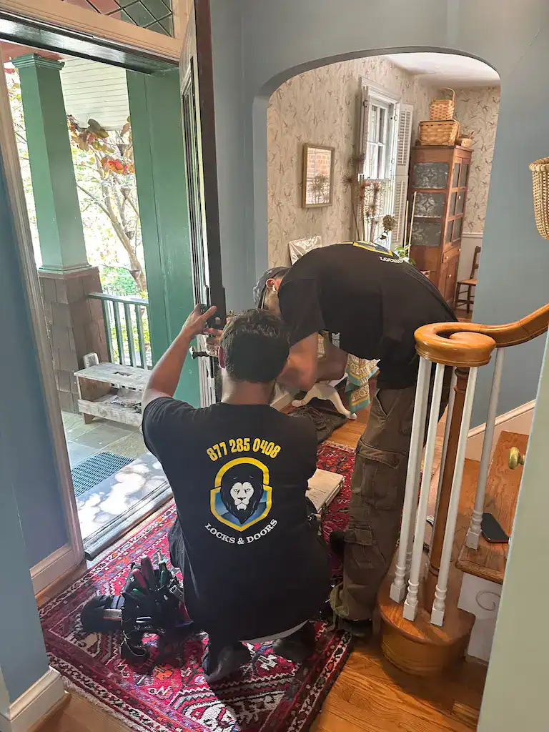 King Locksmith residential locksmith technicians installing and upgrading front door lock hardware inside a Severn Maryland home for enhanced home security and peace of mind