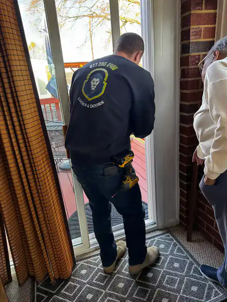 King Locksmith technician installing and adjusting a residential door lock for a homeowner in Chillum Maryland, providing professional lock rekeying, deadbolt installation, smart lock setup, and home security upgrades.