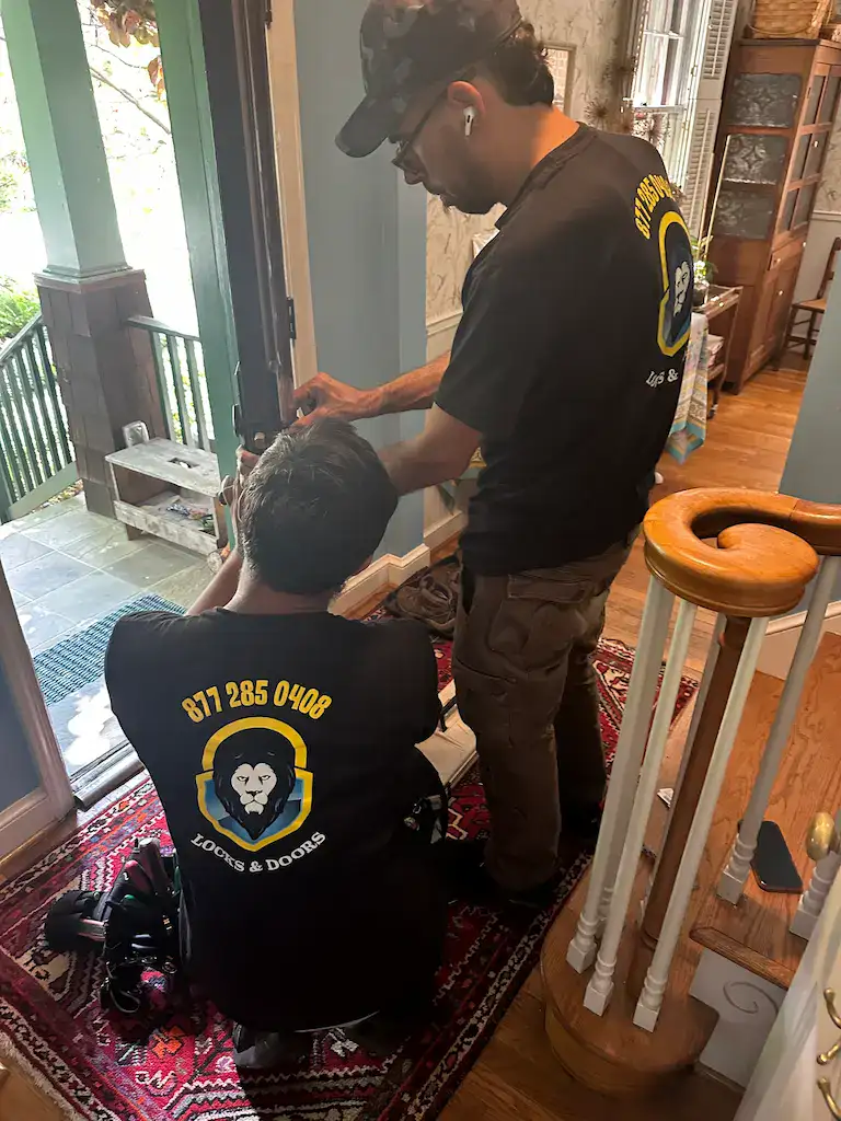 King Locksmith & Doors technician providing residential locksmith service in Laurel Maryland, performing lock installation and rekeying at a home entry door.