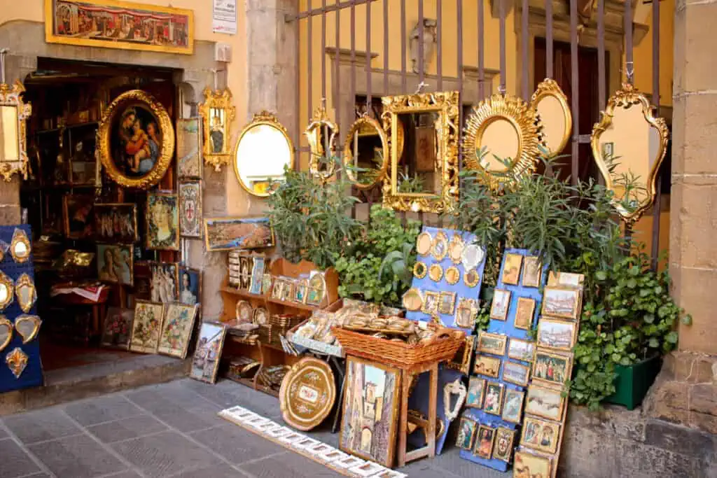 a vintage store filled with mirrors and art pieces