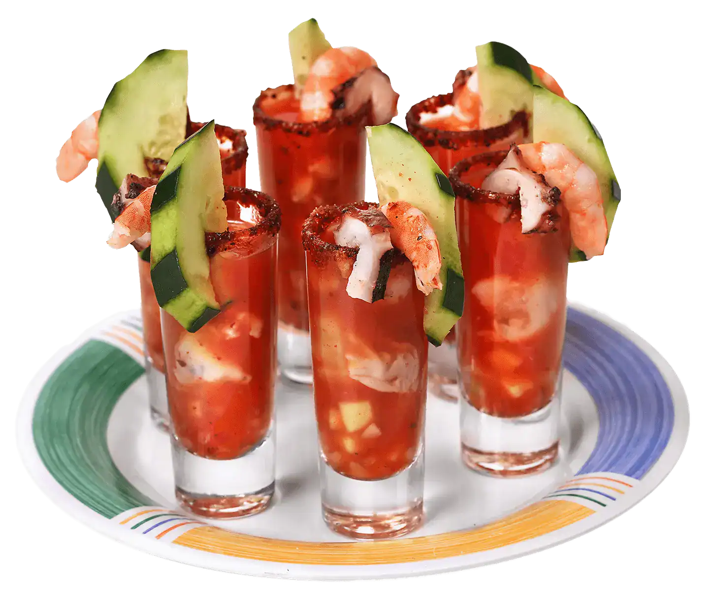 Seafood shots with shrimp, cucumber, and tomato in small glasses for San Blas cuisine.