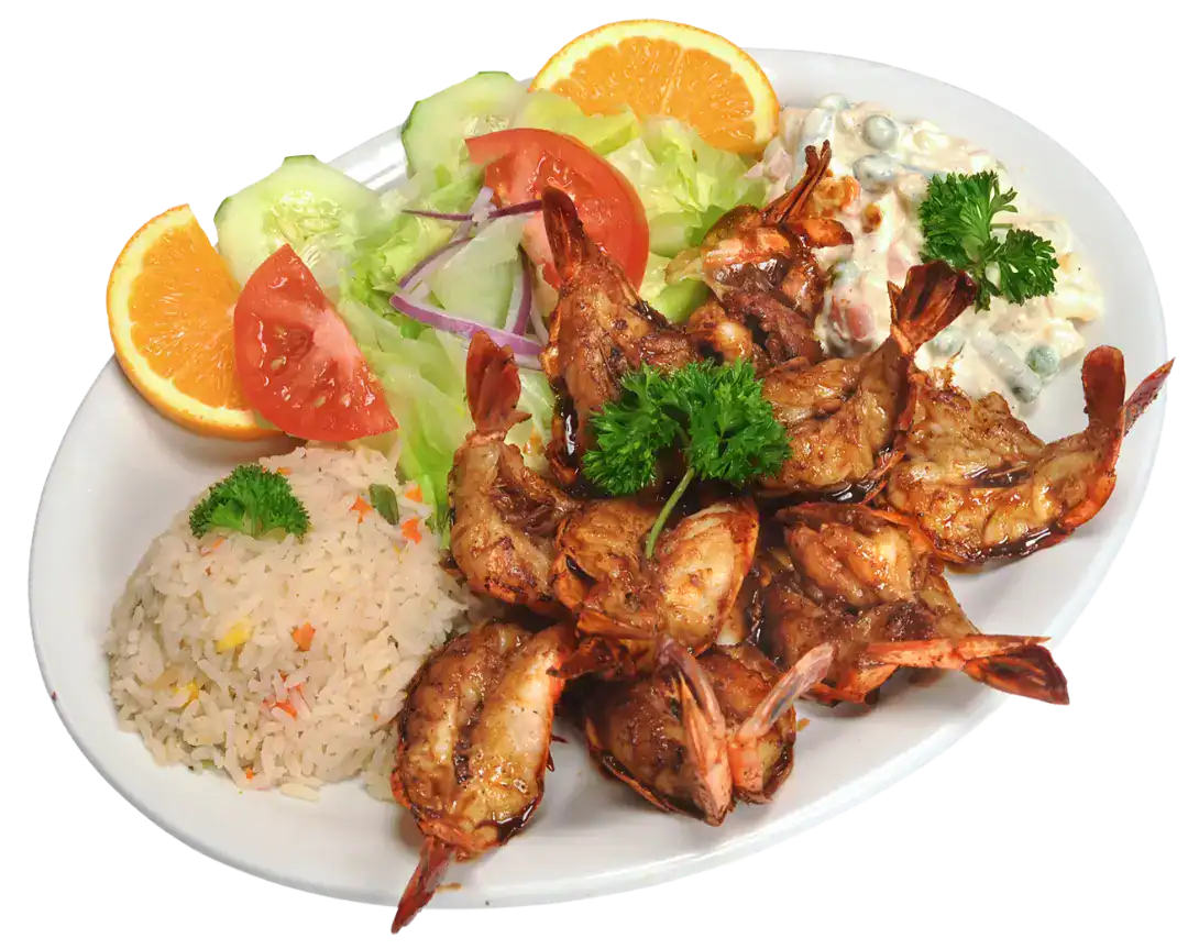 Camarones Zarandeados served with rice, salad, and orange slices on a white plate.