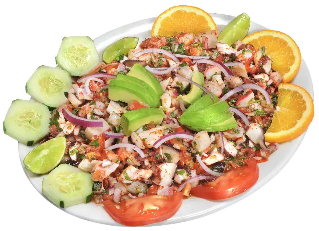 Ceviche Mixto with seafood, vegetables, and citrus slices on a white plate.