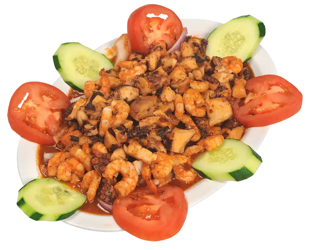 Fresh seafood salad with shrimp, tomatoes, and cucumbers on a white plate.