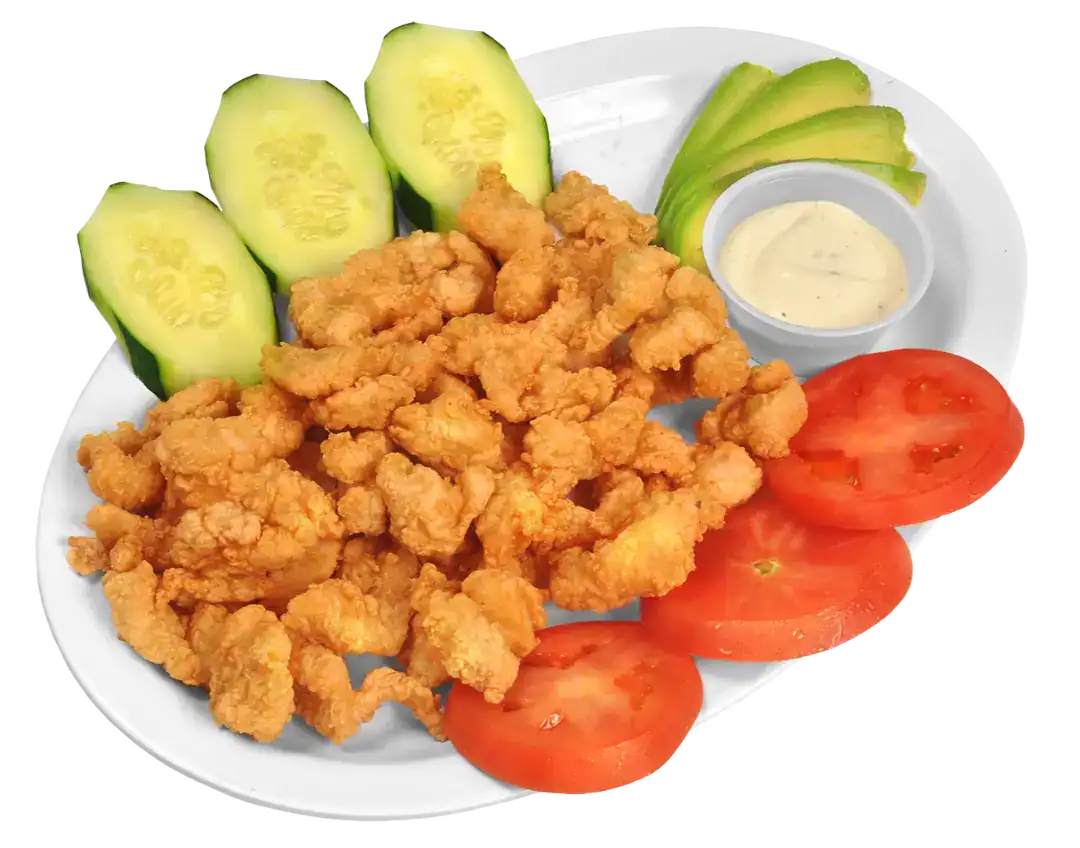 Fried fish chicharrón with cucumber, tomato, and dipping sauce.