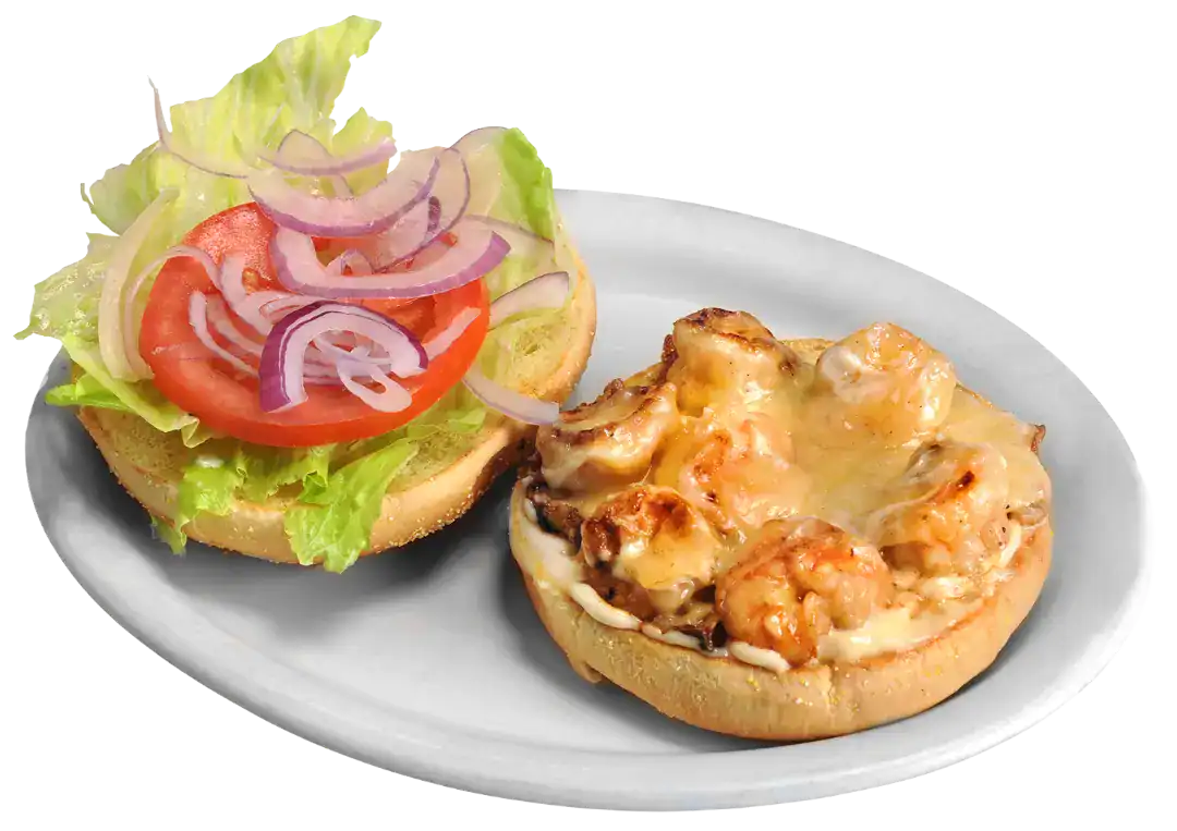 Shrimp burger with lettuce, tomato, and onion on a bun.