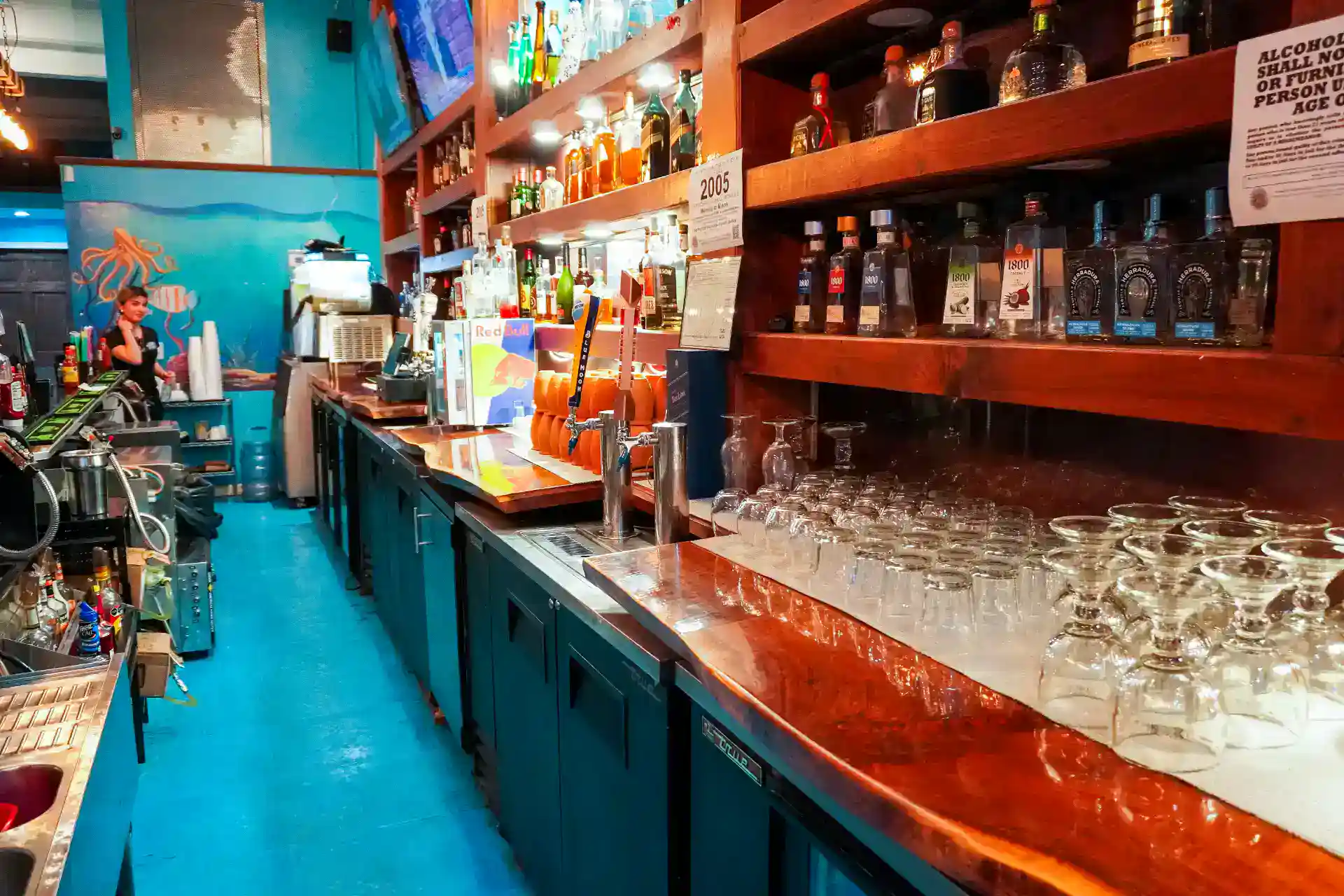 Vibrant bar with colorful bottles and glasses in San Blas.
