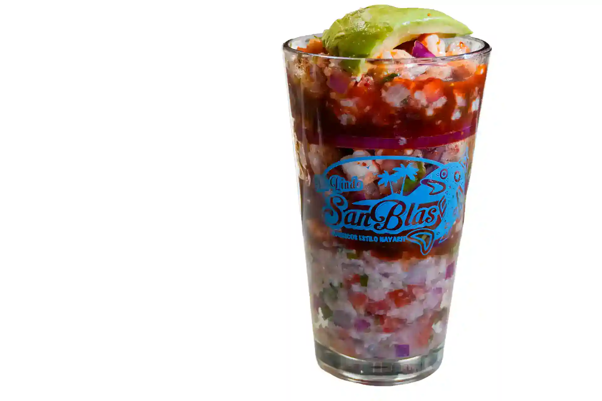 Seafood cocktail in a glass with shrimp, avocado, and cocktail sauce.