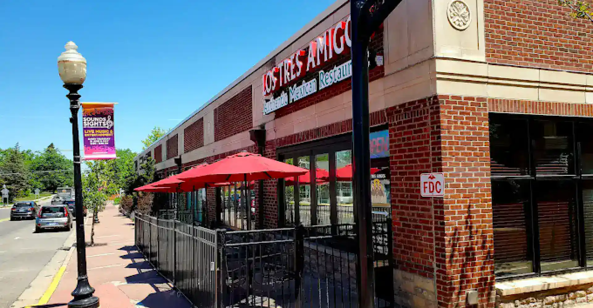 Modern restaurant website design with outdoor seating and brick facade.