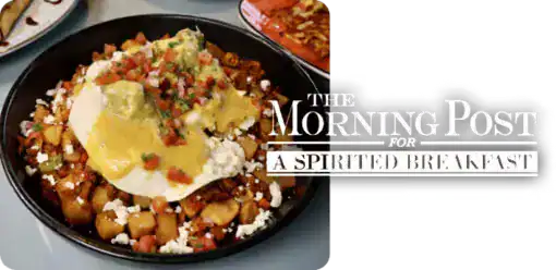 Breakfast bowl with eggs, vegetables, and toppings for a healthy start.