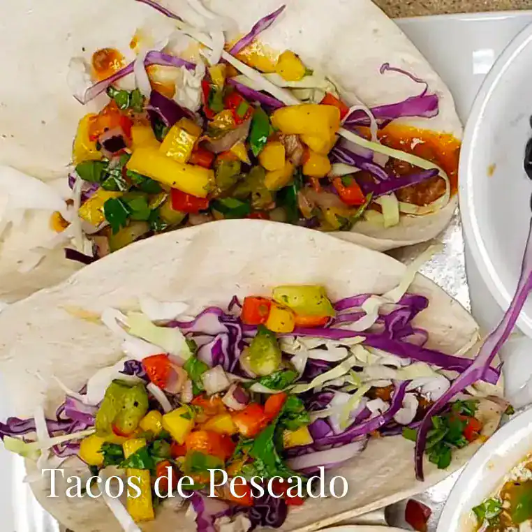 Vibrant fish tacos topped with fresh vegetables, perfect for a tasty menu choice.