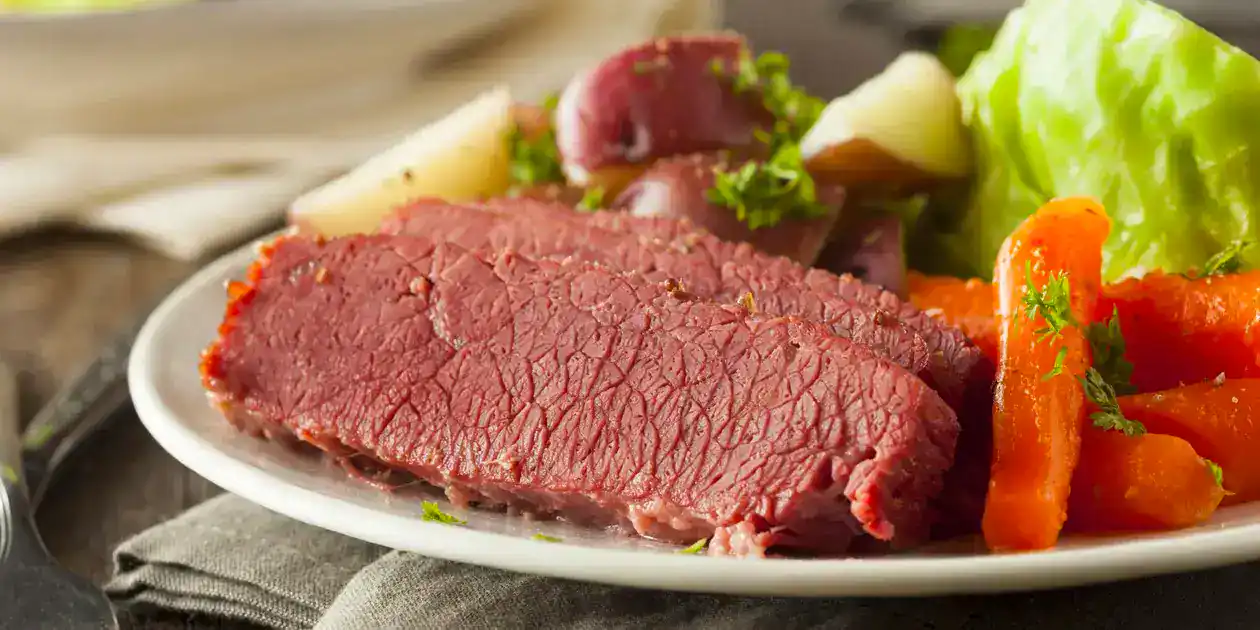 Delicious cooked beef with vegetables on a plate.