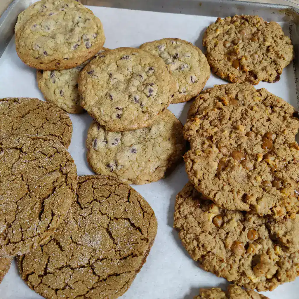 Freshly baked chocolate chip cookies with gooey chocolate chips and crispy edges.