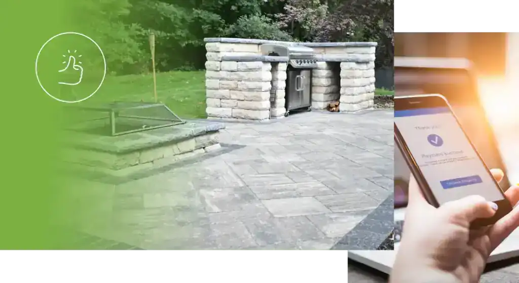 Outdoor kitchen with stone grill and paved patio for cooking and entertaining.