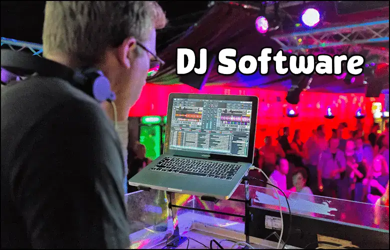 A DJ stands at a booth using DJ software on a laptop, performing for a crowd in a colorful, illuminated nightclub.