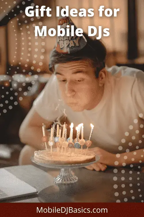 Young person wearing a birthday hat blows out candles on a cake, with the text "Gift Ideas for Mobile DJs" and "MobileDJBasics.com" displayed.