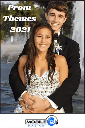 Young couple at prom dressed in formal attire with a waterfall background.