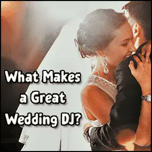 Wedding DJ playing music at a couple's dance with romantic lighting.