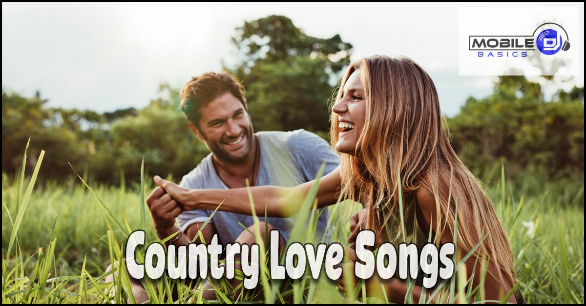 A man and woman sit smiling in tall grass under a cloudy sky, capturing the warmth of a quiet moment together. The words “Country Love Songs” and the Mobile DJ Basics logo appear on the image, setting a romantic country vibe.