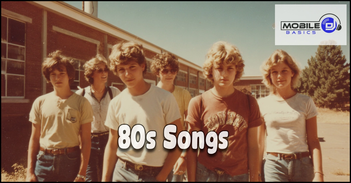 A group of six teenagers wearing casual 80s clothing stand outside a brick school building, capturing the carefree vibe often celebrated in popular 80s songs. “80s Songs” text is overlaid; a “Mobile Basics” logo appears in the top right corner.