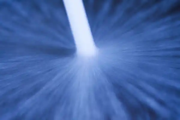 Close-up of a white liquid being poured in a dynamic splash on a blue surface. At Moore Home Services, we use only safe, professional-grade solutions for your home’s plumbing and drain needs—always guaranteeing clean service and trustworthy results from our expert team.