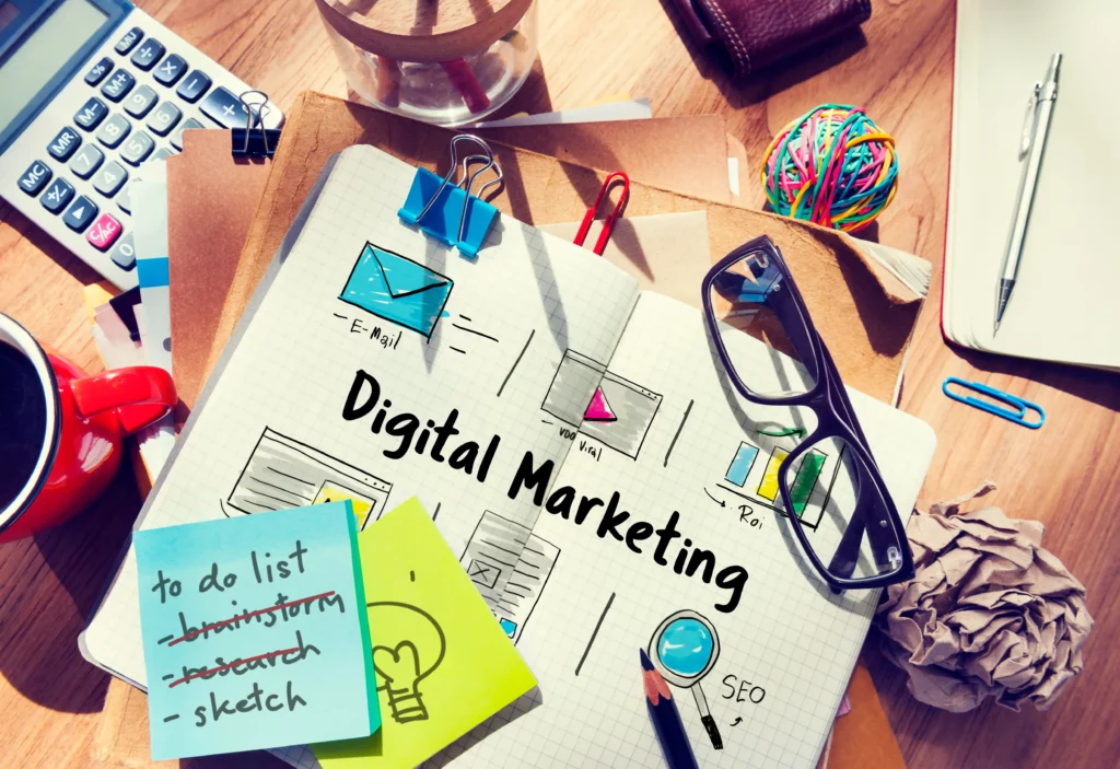 Multiple digital marketing strategies in a notebook.