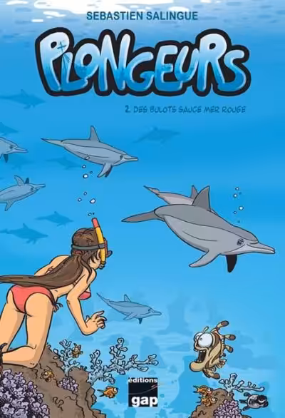 Une plongeuse explore les fonds marins de la Mer Rouge, entourée de dauphins, illustrant l'aventure sous-marine. #Plongée