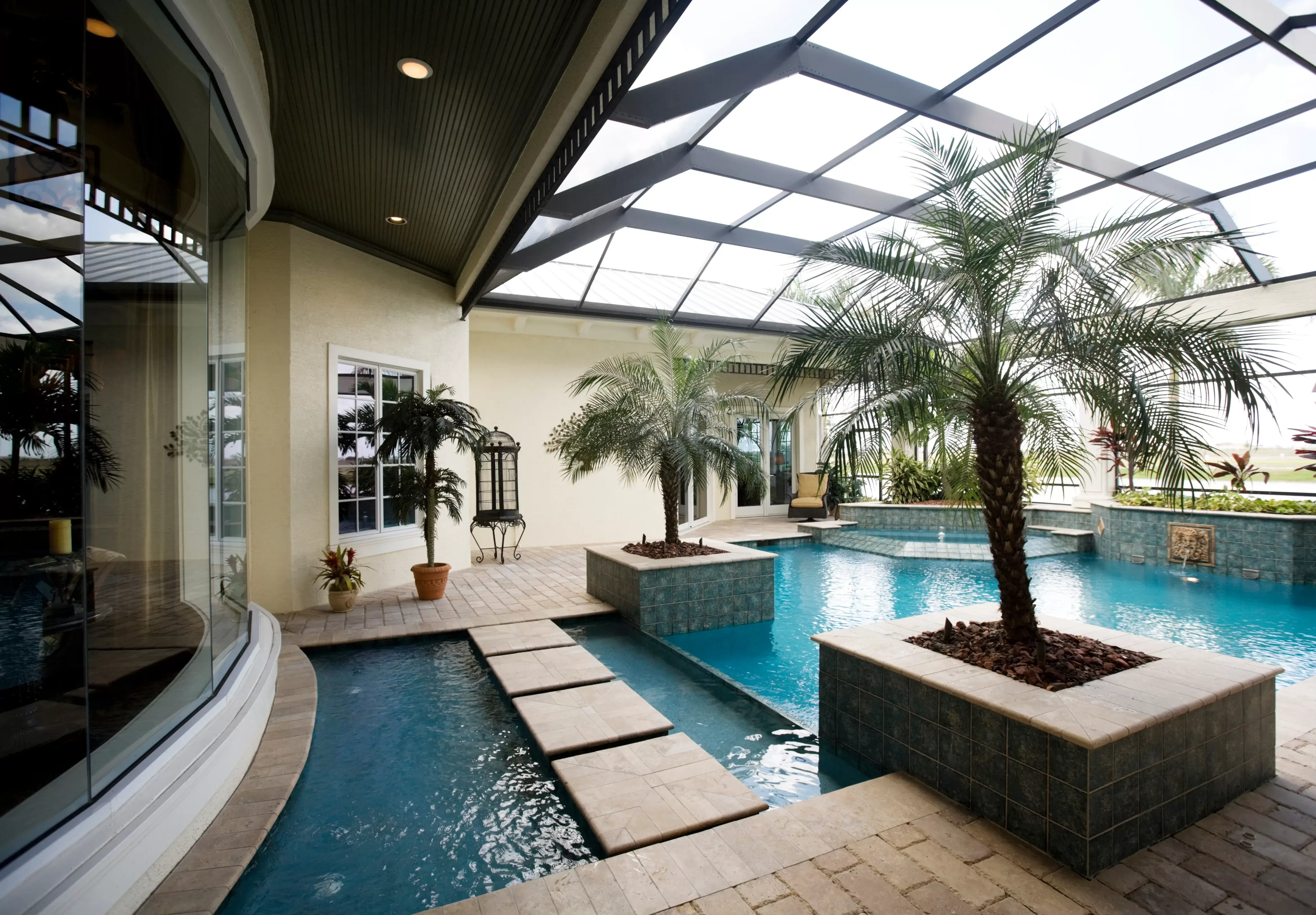 Lanai Extensions: Can You Extend a Lanai? a beautiful lanai extension is right off the home and features a beautiful pool and paver patio.