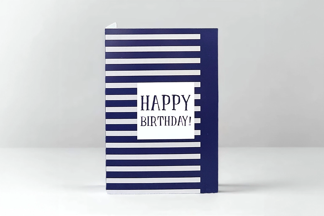 Birthday card that says "Happy birthday" with stripe design
