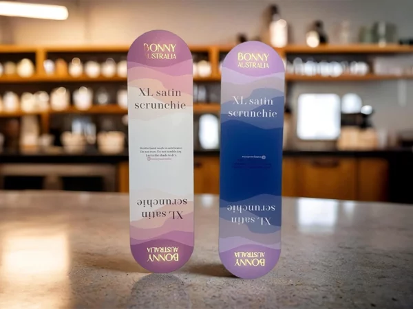 Custom shaped oblong marketing cards with gold foiling