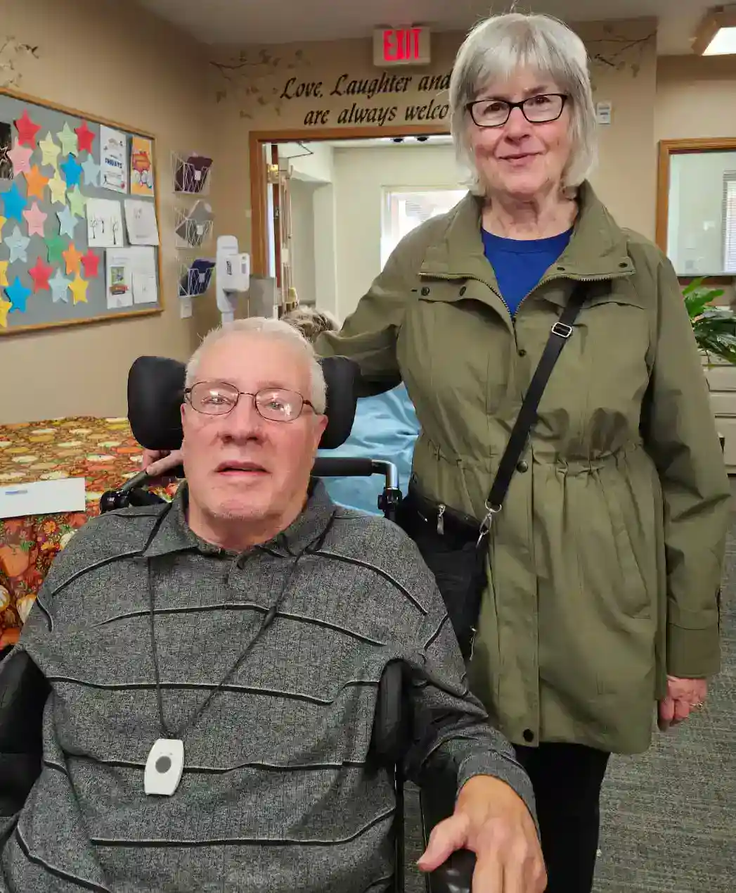 Caregiver and patient in supportive environment at All Season Innovations.