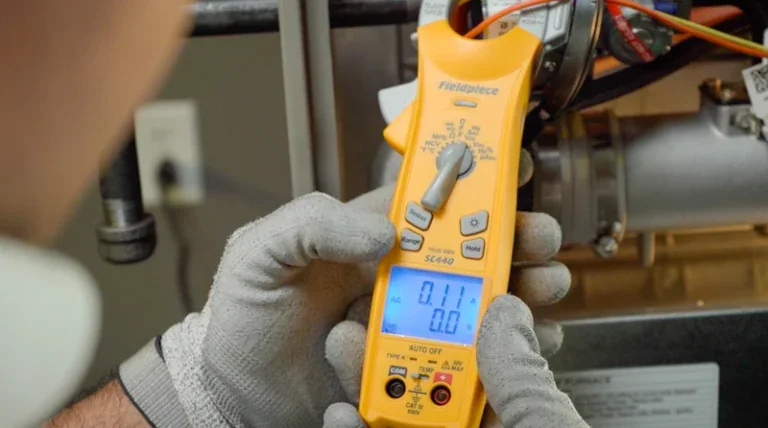 A Service Champions technician checks electrical values with care during a Brea, CA heating install, ensuring reliable home comfort.