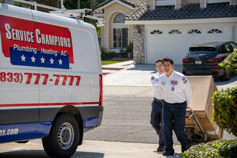 Service Champions technicians bring a new AC unit to a Brea, CA home, offering trustworthy, caring service and dependable comfort.