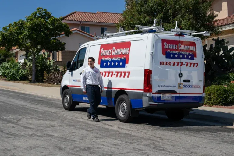A friendly Service Champions technician stands by the company van in Brea, CA, ready to expertly install a water softener for a local home.