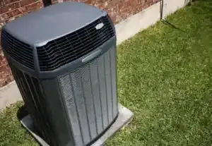 A new AC unit, expertly installed in Brea, CA by Service Champions, rests beside a brick home—ensuring cool comfort and reliability.
