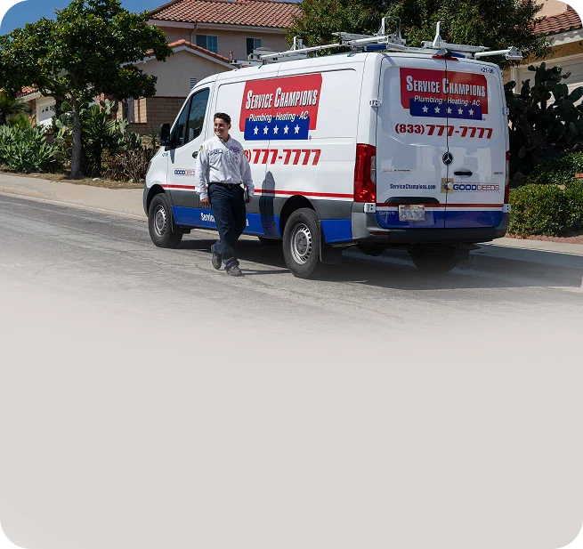 A friendly Service Champions technician stands by a company van on a sunny neighborhood street, ready to serve local families’ comfort needs.