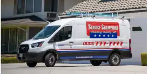 A trusted Service Champions van with a roof ladder sits in a driveway, ready to provide caring HVAC and plumbing help to local homes.