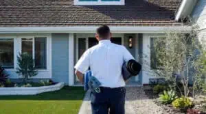 A friendly Service Champions pro arrives at a Southern California home, ready with mats and plans to ensure reliable, expert care.