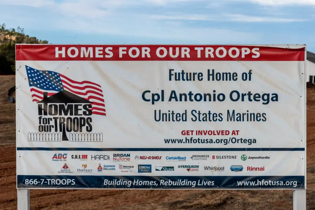 A banner displays the message “Future Home of Cpl Antonio Ortega, United States Marines,” accompanied by the “Homes for Our Troops” logo and website information. This heartfelt display highlights Service Champions’ dedication to supporting veterans and the community, reflecting their trusted role as a leading HVAC, plumbing, and drain expert committed to providing dependable comfort services to Southern California families.