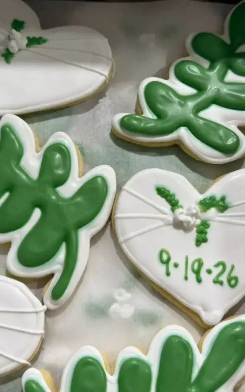 Decorative heart and holly cookies for Christmas from Smutz Girls Bakery.