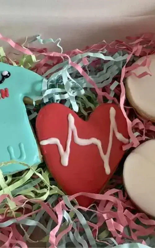 Decorative cookies shaped like medical items and a heart for bakery treats.