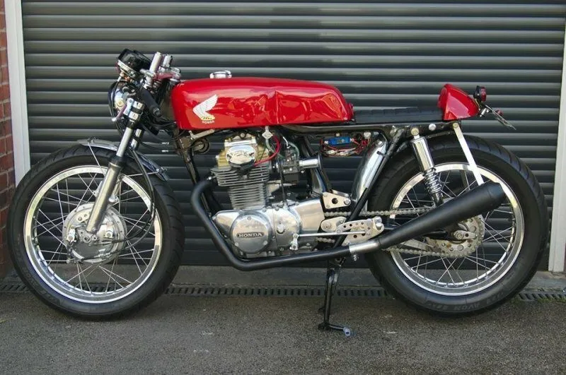 A painted Ducati tank on a Honda CB350